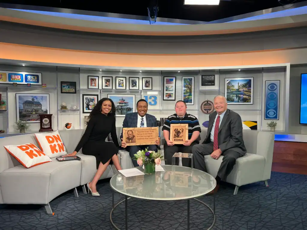 Dr. Robert Ireland and Spike Valway showing Spike's artwork on CBS Baltimore.