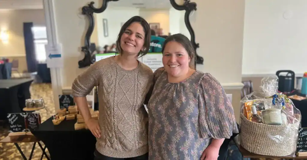 Bello Machre staff member Hannah standing with Moonlit Acres Retreat Farm founder Holly