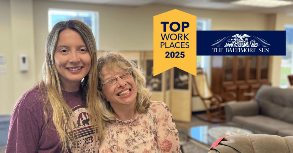 Employment Specialist smiling alongside an individual supported by Bello Machre while on the job