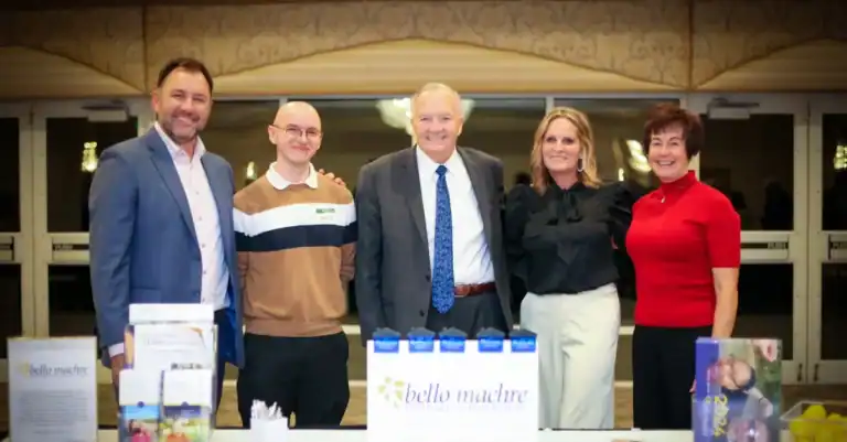 Dr. Robert Ireland and members of the Bello Machre leadership team standing with BetterTogether founders David and Dawn Orso at the community event.