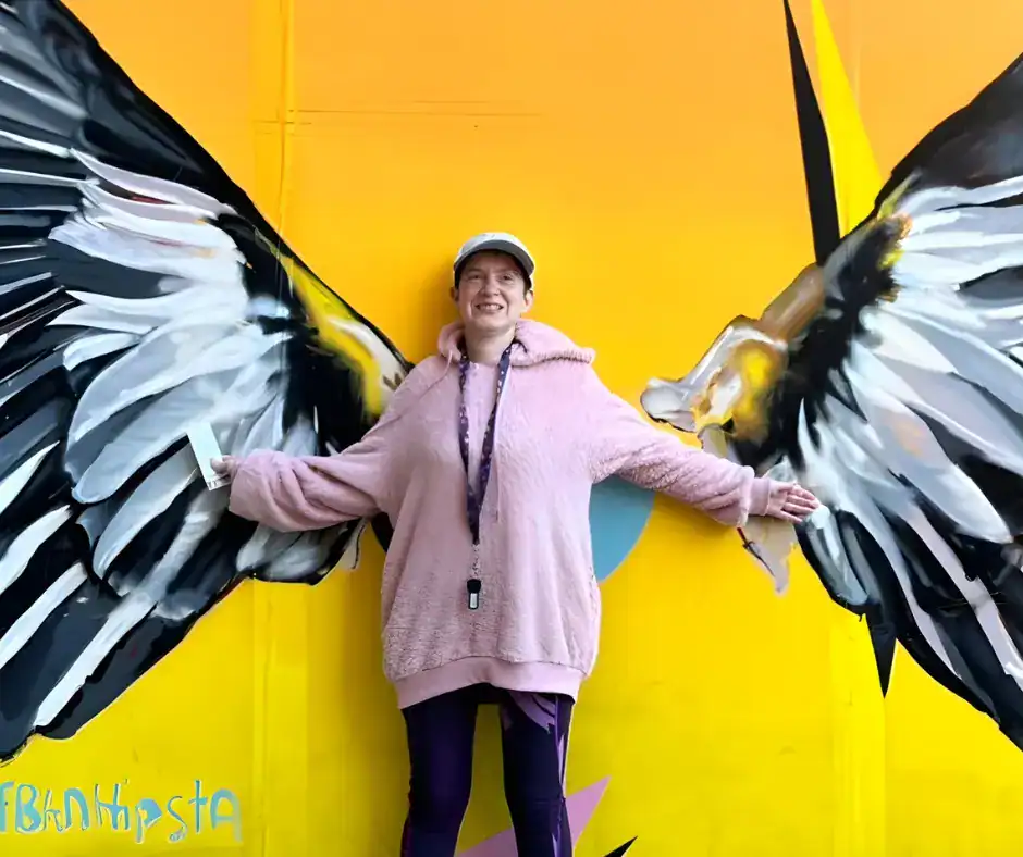 CDS recipient having fun while enjoying some beautiful wall art!