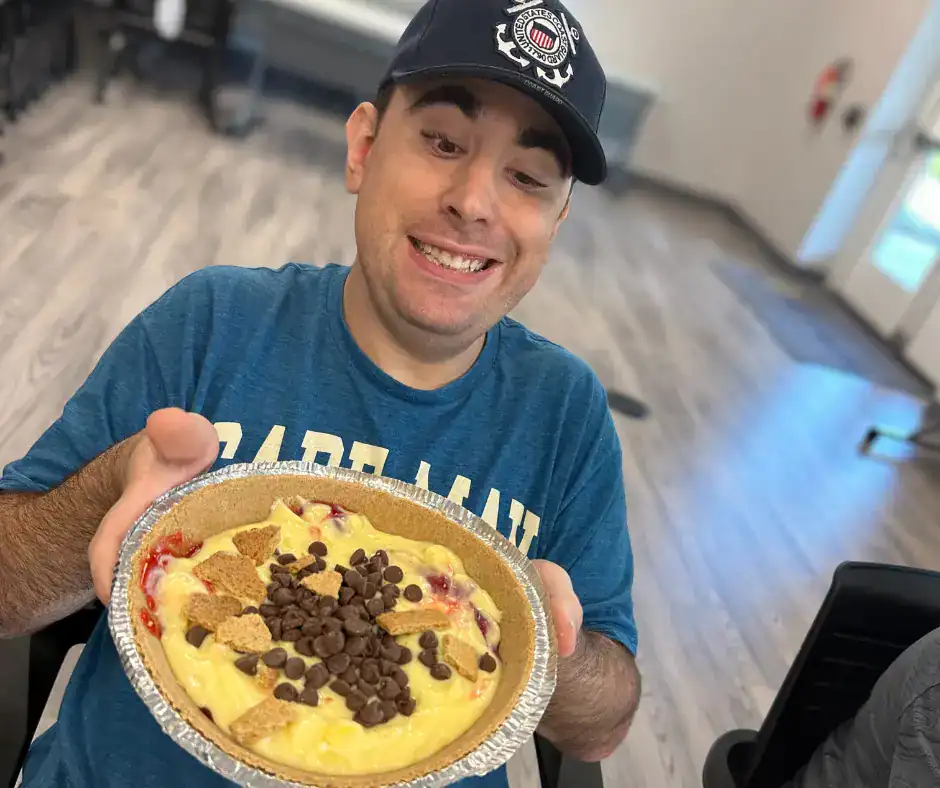 CDS service recipient enjoying baking a pie