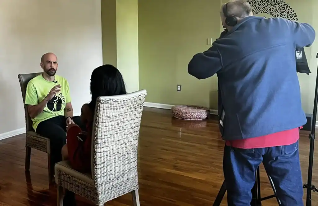 Todd sitting in interview with Kara Burnett from WMAR-TV.