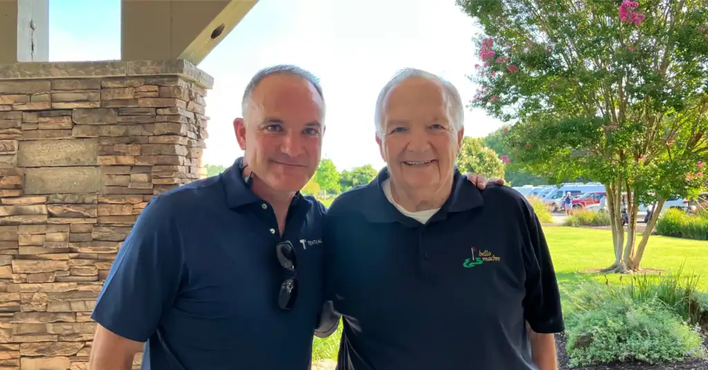 Dr. Ireland and Shane Ireland at golf tournament.